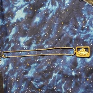 Gold tone lion head pendant